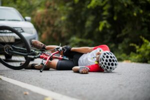 bike riders hit by a car causing common bicycle accident injuries